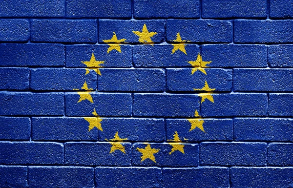 Vlajka Evropské unie na cihlovou zeď — Stock fotografie