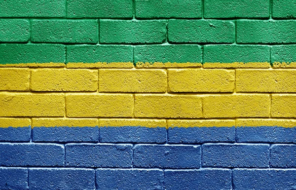 Flagge von Gabon auf Ziegelsteinmauer — Stockfoto
