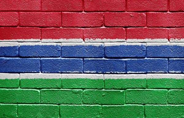 Vlajka Gambie na cihlovou zeď — Stock fotografie