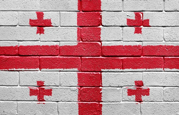 Georgias flagg på murvegg – stockfoto