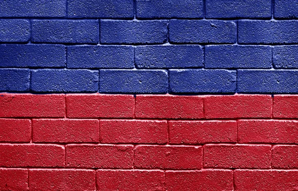 Bandiera di Haiti sul muro di mattoni — Foto Stock
