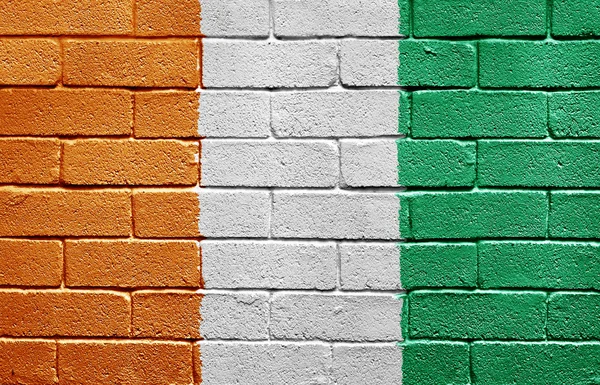 Flag of Ivory Coast on brick wall — Stock Photo, Image