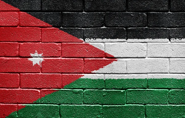 벽돌 벽에 요르단의 국기 — 스톡 사진