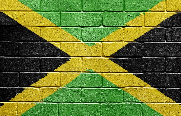 Vlajka Jamajky na cihlovou zeď — Stock fotografie
