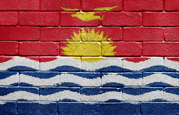 Kiribati zászlaja a téglafal — Stock Fotó