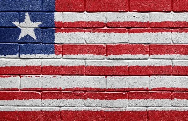 Liberya bayrağı tuğla duvar — Stok fotoğraf