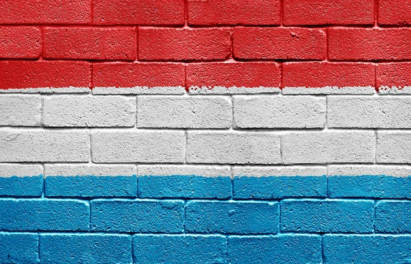 Bandeira do Luxemburgo no muro de tijolos — Fotografia de Stock