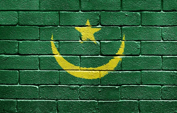 A téglafal Mauritánia zászlaja — Stock Fotó
