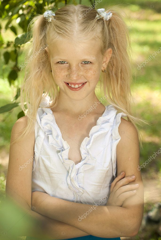 Blonde girl with freckles eight years Stock Photo by ©Dudaeva 5890945