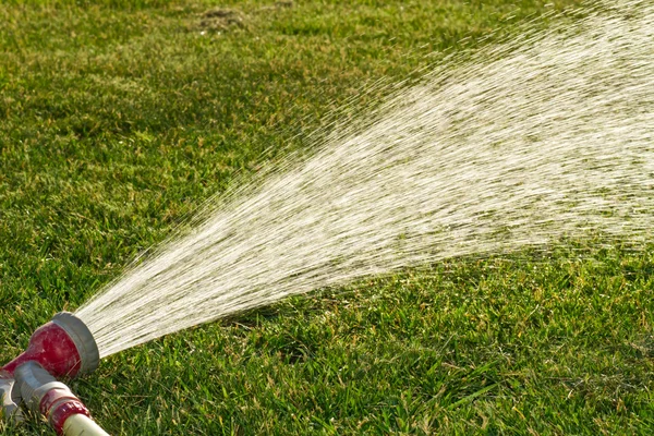 Watering lawns — Stock Photo, Image