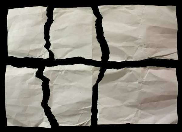 Gescheurd echte papier kladjes op zwarte achtergrond — Stockfoto