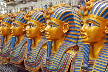 Golden statues of the pharaohs in the souvenir shop, oriental gifts clipart