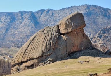 Bright blue sky over the rocks, mountain-like turtle clipart