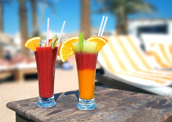 stock image Cocktails from fresh fruit in a tall glass with tubes