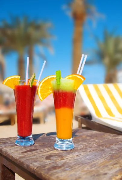 stock image Cocktails from fresh fruit in a tall glass with tubes