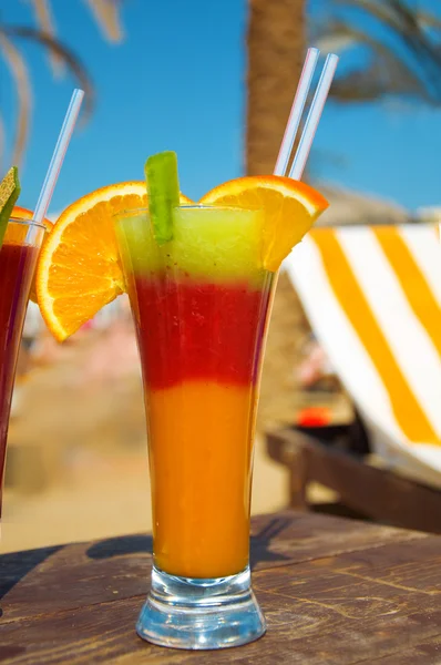 stock image Cocktails from fresh fruit in a tall glass with tubes