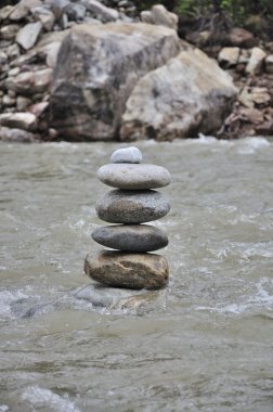 Cairn on the river clipart