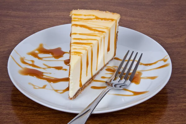 stock image Caramel Drizzled Cheesecake on a Plate