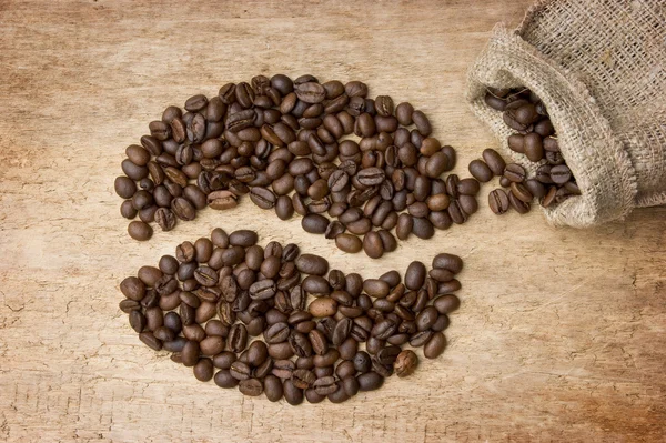 Granos de café en la Junta —  Fotos de Stock