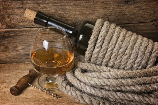 Bottle of wine wrapped with rope Stock Image