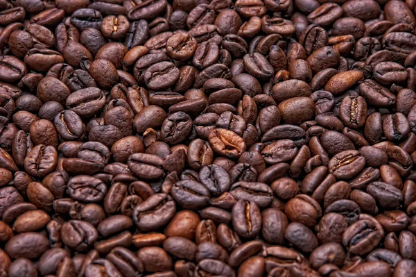 Pozadí černé kávová zrna — Stock fotografie