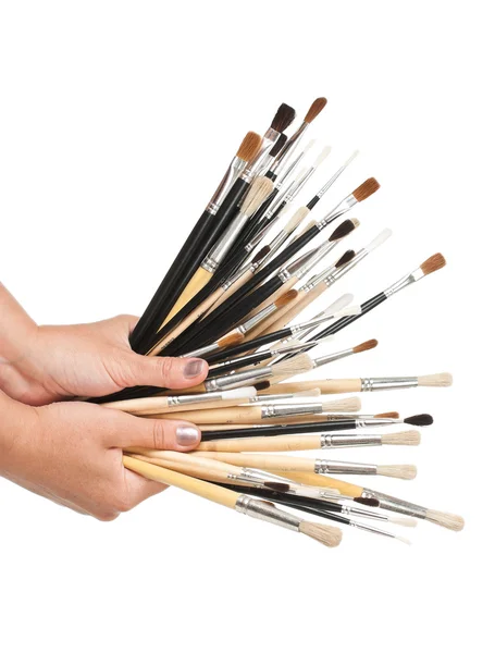 Brushes in hand — Stock Photo, Image