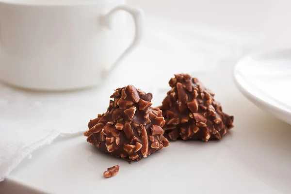 stock image Chocolate candy with nuts and tea