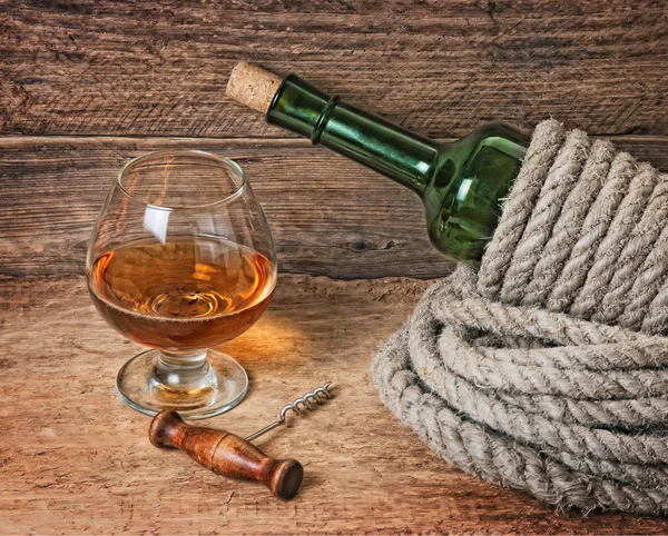 Bottle of wine wrapped with rope Royalty Free Stock Photos