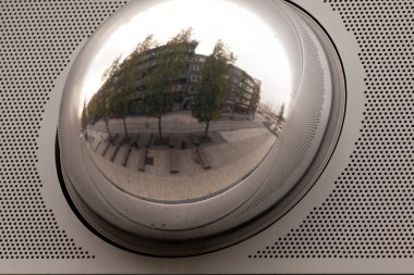 Cityscape reflection in metal sphere facade detail clipart