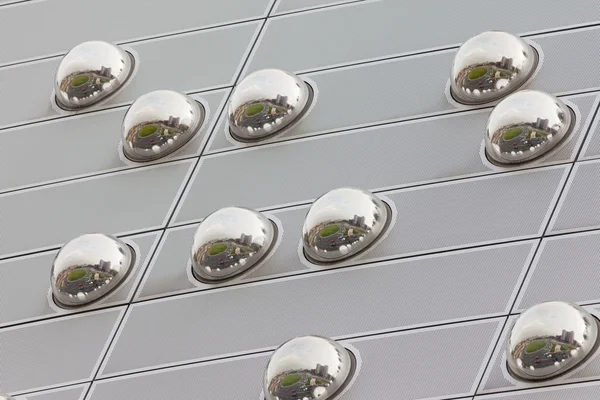 Cityscape reflection in metal sphere facade detail — Stock Photo, Image