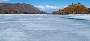 Skiing on Frozen Lake Laberge, Yukon, Canada clipart