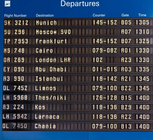Airport departures information board — Stock Photo, Image
