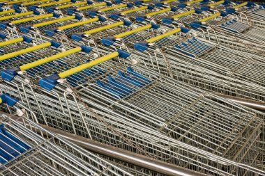Rows of lined-up Shopping Carts clipart