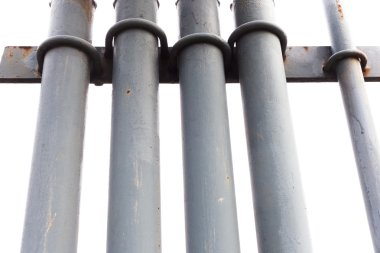 Grey painted metal pipes isolated on white clipart