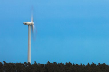 Wind turbine spinning. clipart