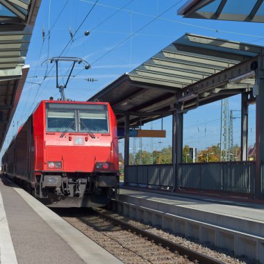 Commuter train at station clipart