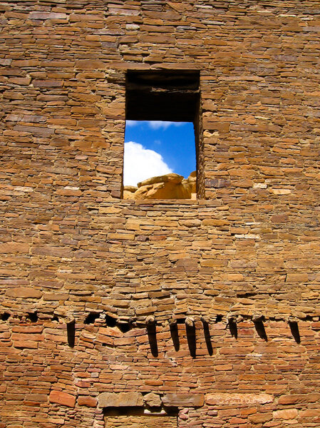 Ruin wall with window opening of laid sandstone bricks of pueblo bonito in chaco canyon, NM, USA, center of sunken Anasazi Culture of ancestral native Americans
