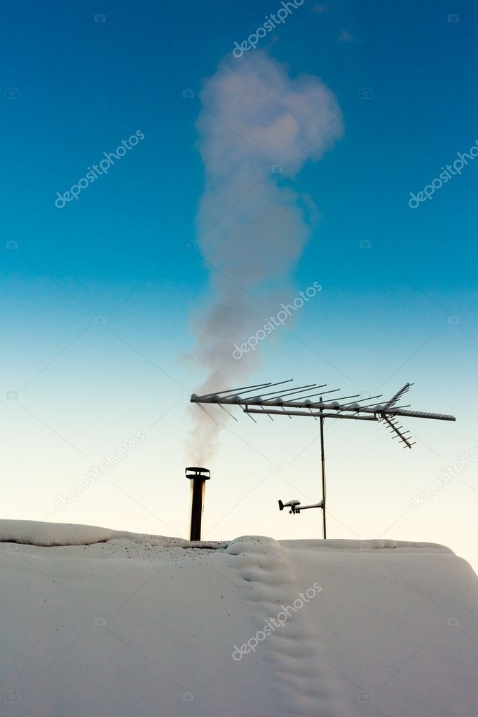 Smoking chimney in winter
