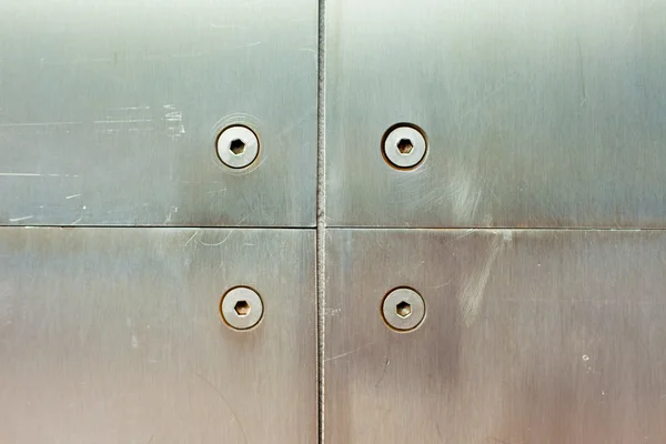 Stainless steel screws and panels — Stock Photo, Image