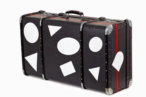 Vecchia valigia usata con adesivi da viaggio in bianco — Foto Stock