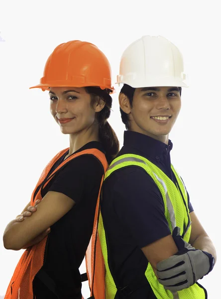 Travailleurs du casque de sécurité hommes et femmes — Photo
