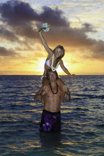 Newlywed couple in their forties in the ocean — Zdjęcie stockowe