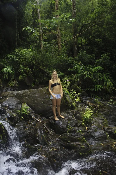 Teenage girl in a tropical forest — Stock Photo, Image