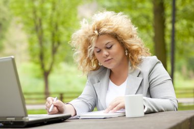 Woman working in the the park clipart