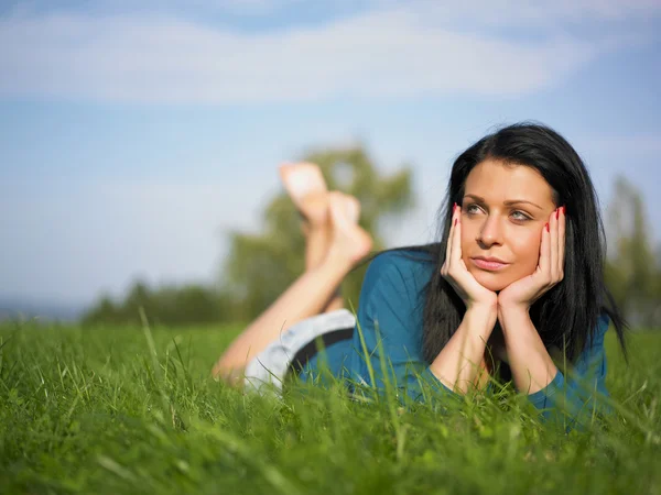 Young woman joy and relaxing on grass — Stock Photo, Image