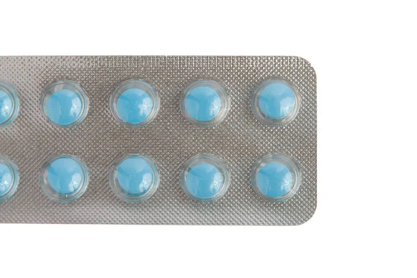 Close-up de um pacote de comprimidos azuis — Fotografia de Stock