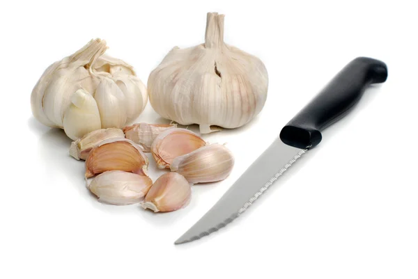 stock image Two garlic and kitchen knife