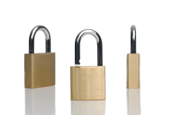 Três fechaduras de ouro segurança — Fotografia de Stock