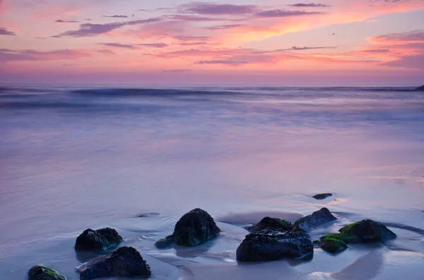 Sunset on a beach — Stock Photo, Image