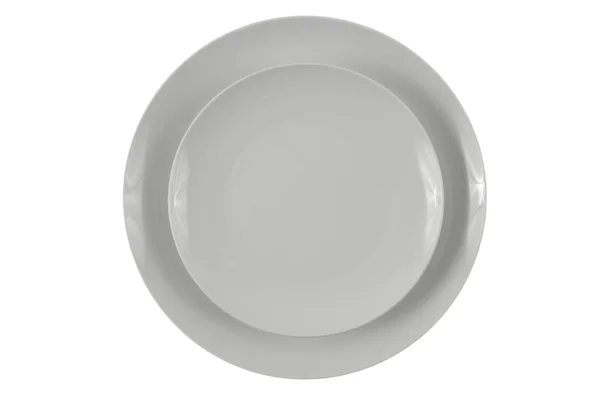 Круглые белые тарелки — стоковое фото